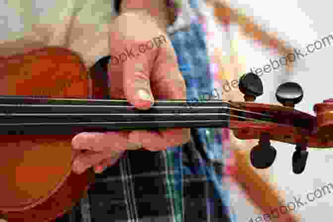 A Close Up Of A Fiddler's Hands On The Strings Of A Fiddle. Louisiana Fiddlers (American Made Music Series)