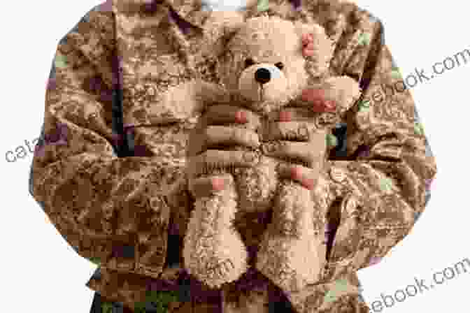 A Soldier Holding Teddy, A Teddy Bear, In His Arms. The Teddy That Went To Iraq