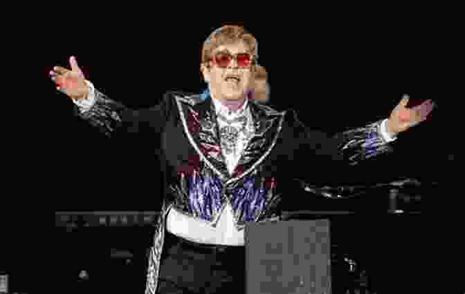 Elton John Performing Live On Stage, Surrounded By Vibrant Lights And A Cheering Crowd Wurlitzer Of Cincinnati: The Name That Means Music To Millions